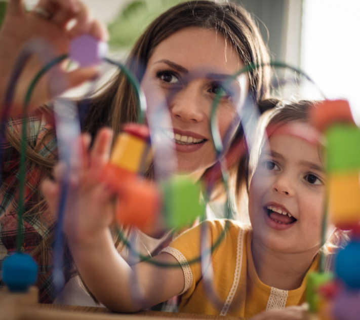 Mother playing with young daughter